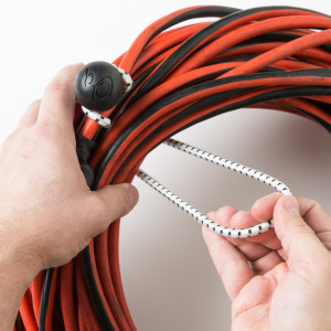 grasp larger loop and wrap around the coiled cord